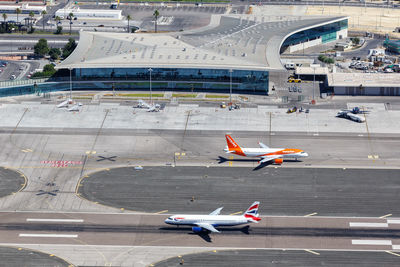 High angle view of airplane on airport runway