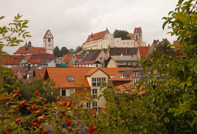 Houses in town against sky