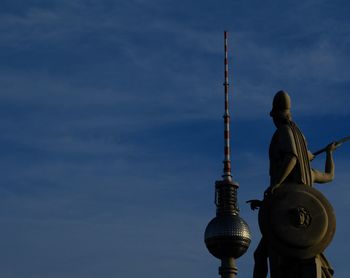 Low angle view of statue against cloudy sky