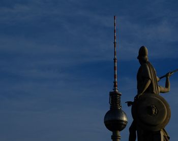 Low angle view of statue against cloudy sky