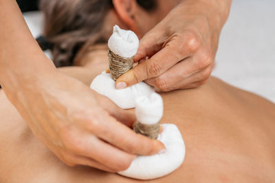 Potli dry massage therapy at ayurvedic wellness center. 