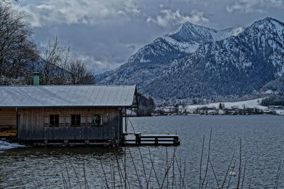Scenic view of snow covered mountains against sky