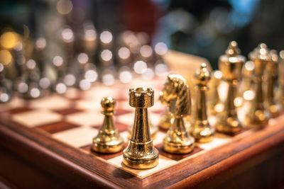 Close-up of chess pieces on table