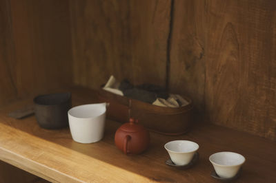 High angle view of crockery on shelf