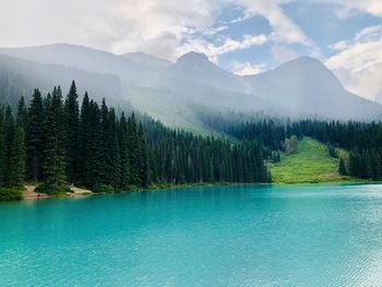 Scenic view of lake and mountains against sky