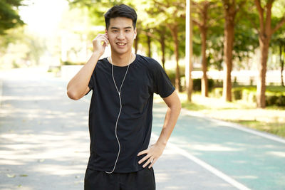 Portrait of young man standing outdoors