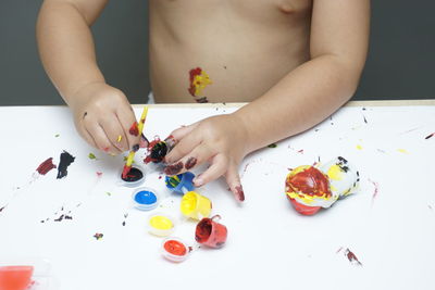 High angle view of baby hand on table