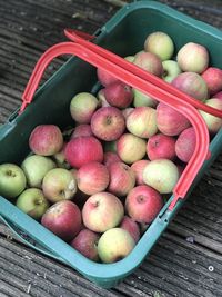 High angle view of apples in basket on table