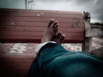 Low section of woman relaxing outdoors