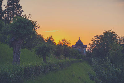 Scenic view of temple against clear sky during sunset