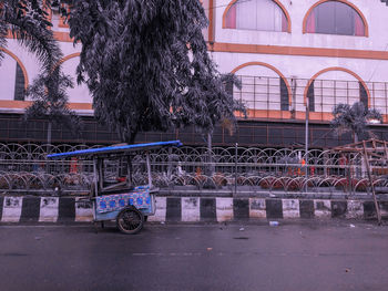 Bicycles on road against building