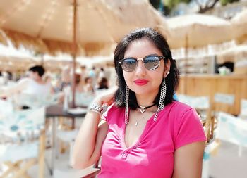 Portrait of young woman wearing sunglasses