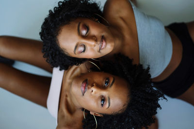 Close up two african woman next to each other portrait