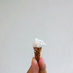 Cropped hand holding ice cream