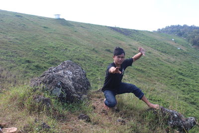 Full length of man on field