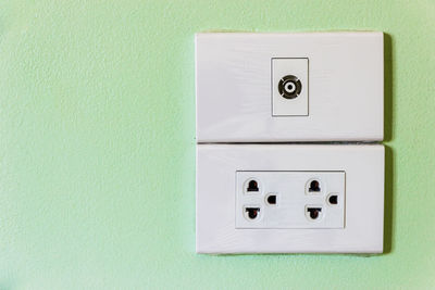 Close-up of electric outlet on wall