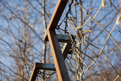 Detail from broken and rusty football goal that stands out in nature