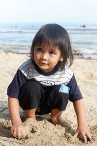 Portrait of cute boy on beach