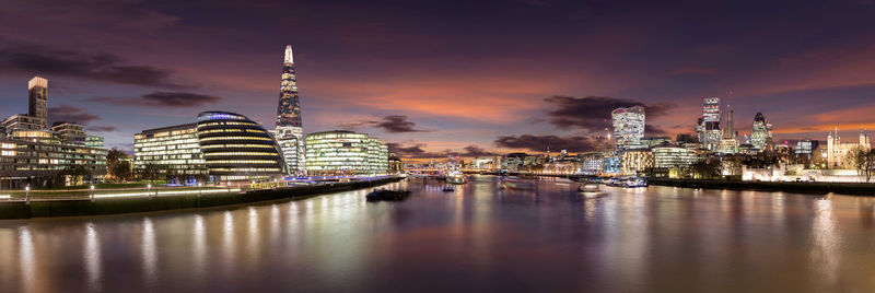 Illuminated city at waterfront