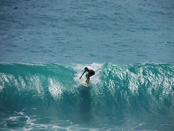 High angle view of man surfing in sea