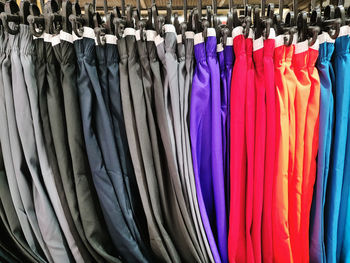 Colorful pants hanging on the rack