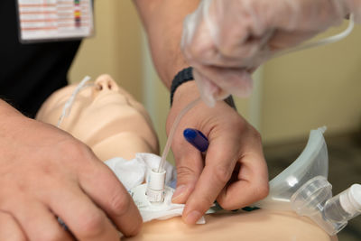 Midsection of doctor examining patient at clinic