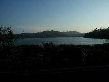 Scenic view of lake with mountains in background