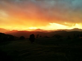 Scenic view of landscape against sky during sunset