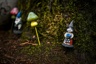 Statue of toy in forest