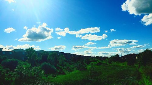 Scenic view of landscape against cloudy sky