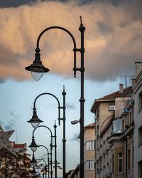 Low angle view of street light against buildings