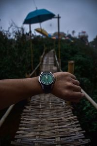 Midsection of person holding umbrella