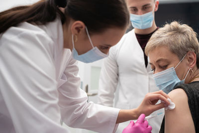 Doctor examining patient in hospital