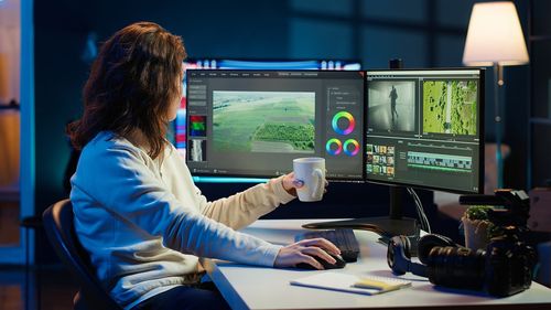 Midsection of woman using laptop on table
