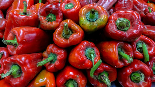 Full frame shot of red bell peppers for sale in market