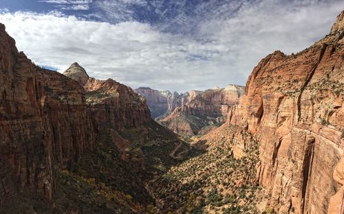 Scenic view of rocky mountains at zion national park against sky