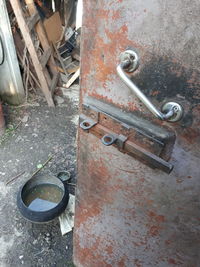 High angle view of old rusty metal door