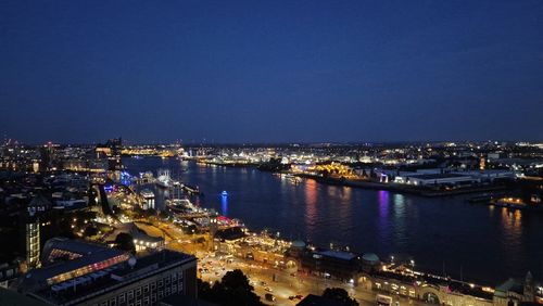 High angle view of illuminated buildings in city at night