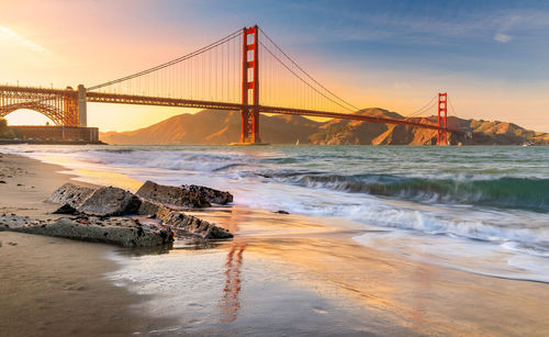 View of suspension bridge at sunset