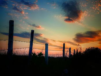 Silhouette trees against sky during sunset