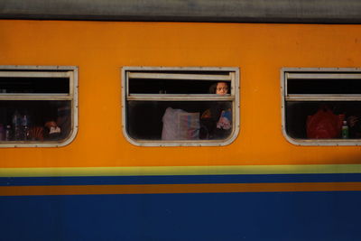 Girl looking through train window