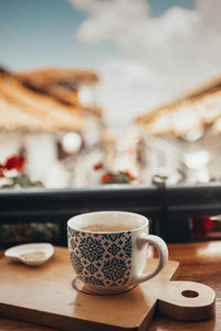 Close-up of coffee cup on table