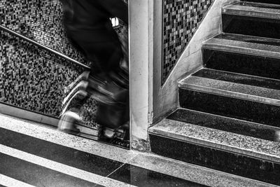 Low section of woman on staircase