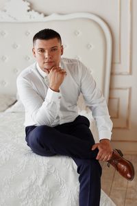 Young man sitting outdoors