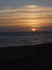 Scenic view of sea at sunset