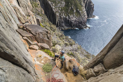 High angle view of rock formation by sea