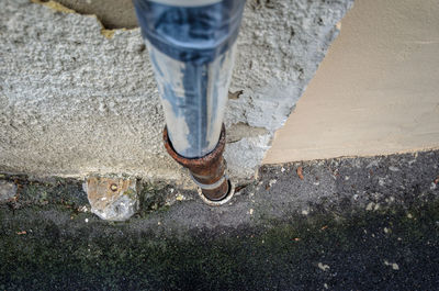 Low section of man standing on street