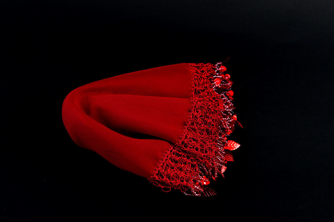 CLOSE-UP OF ILLUMINATED RED LIGHT AGAINST BLACK BACKGROUND