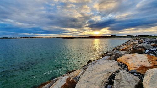 Scenic view of sea against sky during sunset