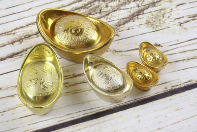 Close-up of ingot feng shui on table